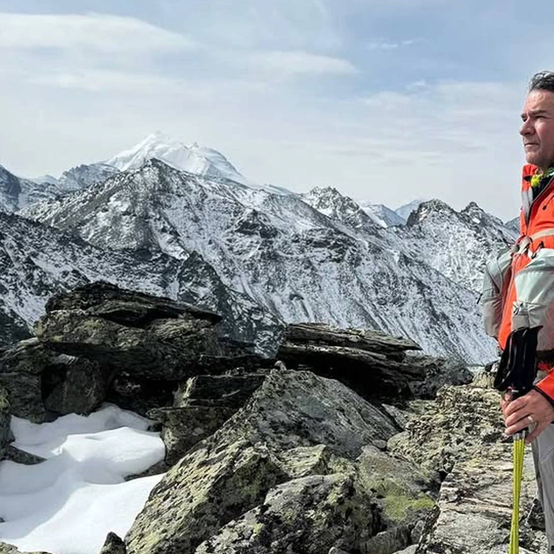 trekker in snowy alpine terrain