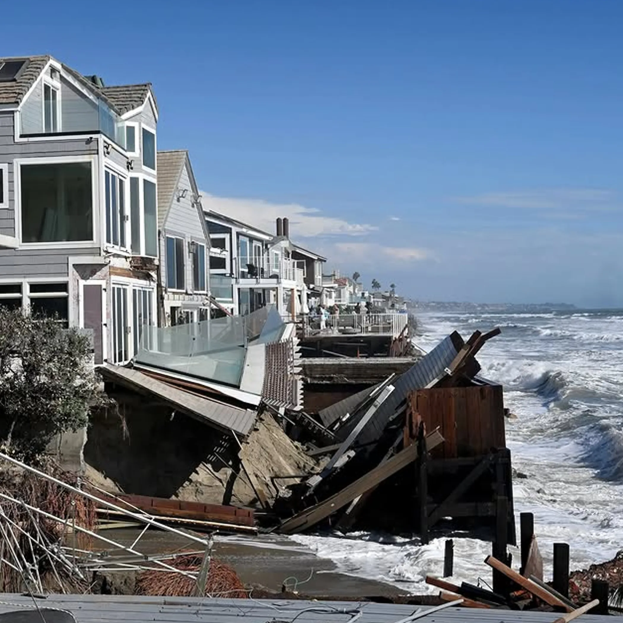 eroded shoreline damaged by powerful surf